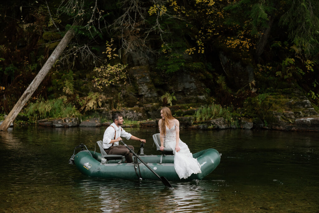 Bride and groom rafting in the river on their wedding day